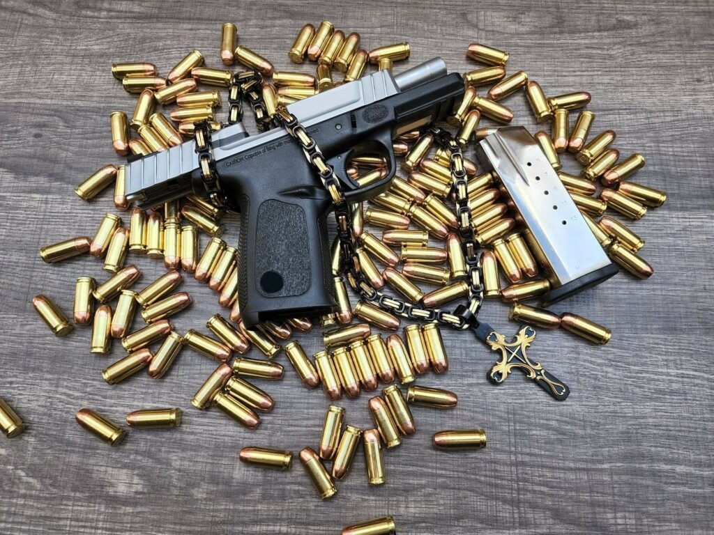 Pistol and Magazine with Bullets and Chained Cross