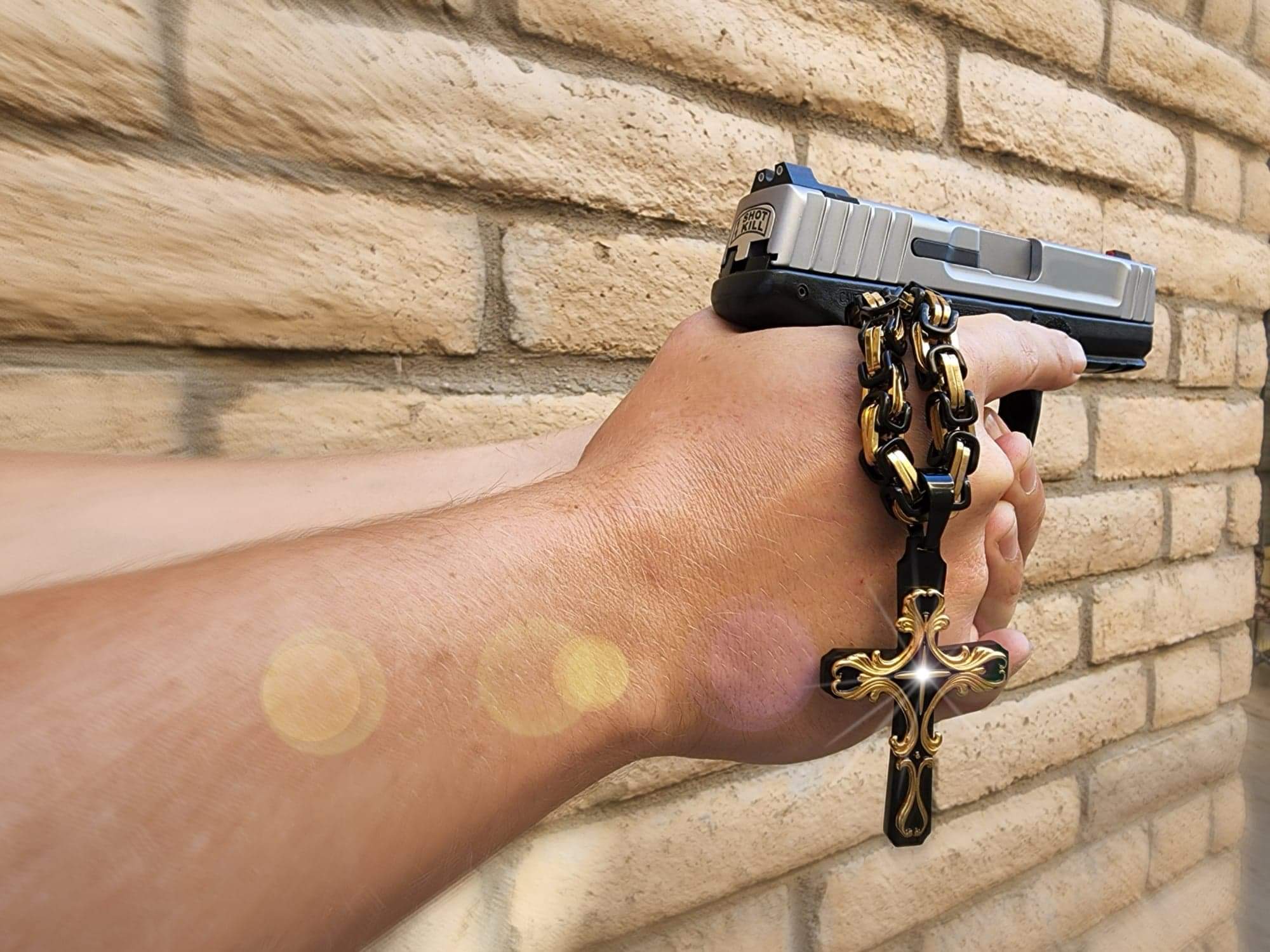 Handling a Gun With a Cross Chain