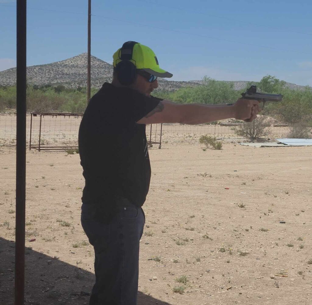 Man firing a gun